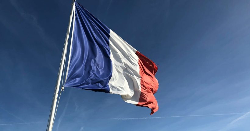 Photo by Anthony Choren Yugoslavia flag under blue sky